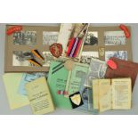 A CARDBOARD BOX CONTAINING AN ARCHIVE OF WWII MEDAL, PAPERWORK, UNIT PATCHES, EPHEMERA AND PHOTO