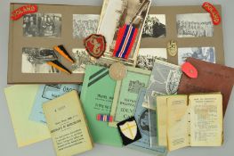 A CARDBOARD BOX CONTAINING AN ARCHIVE OF WWII MEDAL, PAPERWORK, UNIT PATCHES, EPHEMERA AND PHOTO