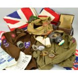 A BOX CONTAINING A NUMBER OF WWII ERA MILITARY UNIFORM ITEMS IN RELATION TO THE R.E.M.E, including