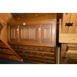 AN OLD CHARM OAK FALL FRONT BUREAU