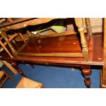 A REPRODUCTION MAHOGANY RECTANGULAR SIDE TABLE with fold over top on turned legs, approximate