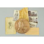 A WWI MEMORIAL DEATH PLAQUE, together with original photographs and C.W.G.C. Paperwork all