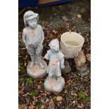 A COMPOSITE GARDEN FIGURE OF A BOY and another of a girl, together with two small squirrel ornaments