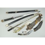 A COPY SAMURI STYLE SWORD AND SCABBARD, with ornate design, a curved sword and leather scabbard with