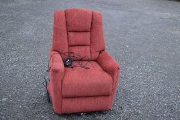 A RED UPHOLSTERED RECLINING CHAIR