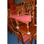 A REPRODUCTION MAHOGANY EXTENDING DINING TABLE and six chairs including two carvers (7)