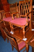 A REPRODUCTION MAHOGANY EXTENDING DINING TABLE and six chairs including two carvers (7)