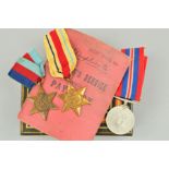 A SMALL TIN CONTAINING A WWII GROUP, to include 1939-45 and Africa Stars, together with War medal (
