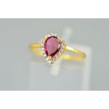 A MODERN SYNTHETIC RUBY AND CUBIC ZIRCONIA PEAR SHAPE CLUSTER RING, ring size K1/2, stamped '916',