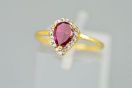 A MODERN SYNTHETIC RUBY AND CUBIC ZIRCONIA PEAR SHAPE CLUSTER RING, ring size K1/2, stamped '916',