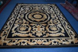 A WOOLLEN BLACK GROUND CARPET SQUARE with gold foliate detail, label to underside reading G H