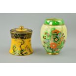 TWO PIECES OF CARLTONWARE to include a covered pot, chinoiserie scenes on yellow ground with black
