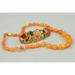 A NATURAL AMBER NECKLACE AND AN AGATE BRACELET, the amber necklace comprising forty one barrel shape