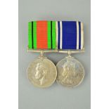 A WWII DEFENCE MEDAL, together with a ER II Police Long Service and Good Conduct medal named to