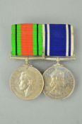 A WWII DEFENCE MEDAL, together with a ER II Police Long Service and Good Conduct medal named to