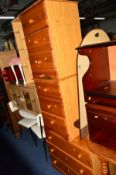 A MODERN PINE CHEST OF THREE DRAWERS and matching pair of three drawer bedside chests (3)