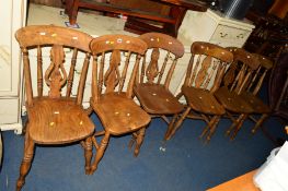 A NEAR SET OF SIX EARLY 20TH CENTURY ELM AND BEECH KITCHEN CHAIRS