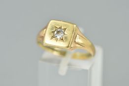 AN EARLY 20TH CENTURY DIAMOND SIGNET RING, centering on a single old European cut diamond, estimated