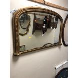 A VICTORIAN GILT WOOD OVERMANTEL MIRROR, width 104cm x height 69cm