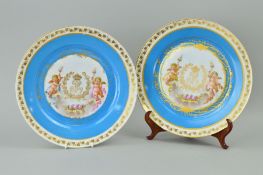 A PAIR OF SEVRES STYLE CABINET PLATES, decorated with cherubs, approximate diameter 24cm (2)