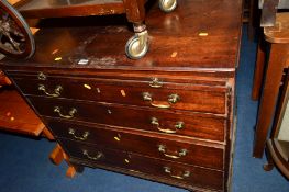 A GEORGIAN MAHOGANY CHEST OF FOUR LONG GRADUATING DRAWERS below a drawing slide with brass swan neck