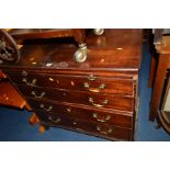 A GEORGIAN MAHOGANY CHEST OF FOUR LONG GRADUATING DRAWERS below a drawing slide with brass swan neck