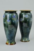 A PAIR OF ROYAL DOULTON STONEWARE VASES, avoid bodies applied with blue foliate roundels against