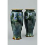 A PAIR OF ROYAL DOULTON STONEWARE VASES, avoid bodies applied with blue foliate roundels against