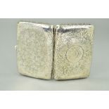 AN EARLY 20TH CENTURY SILVER CIGARETTE CASE, fully engraved in a floral scroll design with a