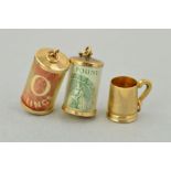 THREE 9CT GOLD CHARMS, to include a tankard, a cased ten shilling note and a cased one pound note,
