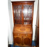 AN EDWARDIAN MAHOGANY BUREAU BOOKCASE, the upper section with double astragal glazed doors, the fall