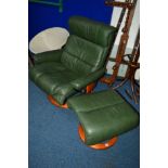 AN EKORNES STRESSLESS GREEN LEATHER RECLINING SWIVEL CHAIR with a matching stool (2)