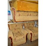 A FLORAL UPHOLSTERED THREE PIECE LOUNGE SUITE comprising of a three seater settee and a pair of