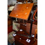 AN EARLY 20TH CENTURY WALNUT TOPPED READING STAND on an adjustable wrought iron base