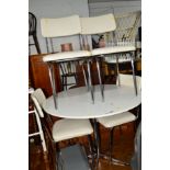 A MODERN CIRCULAR DINING TABLE on a chrome frame and four matching chairs, a modern bevelled edge