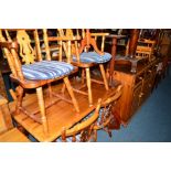 A MODERN PINE DINING TABLE, width 137cm x depth 77cm x height 75cm, six chairs including two carvers