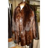 A BROWN CONEY FUR JACKET, a fox fur stole. a long faux fur ladies coat and a sheepskin coat (4)