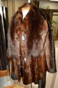 A BROWN CONEY FUR JACKET, a fox fur stole. a long faux fur ladies coat and a sheepskin coat (4)