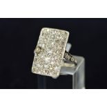 A DIAMOND DRESS RING the rectangular panel pave-set with old cut diamonds to the diamond set