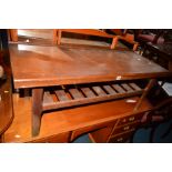 A TEAK COFFEE TABLE with a slatted under shelf