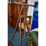TWO STAINED FOLDING ARTISTS STANDS together with an artist easel (3)