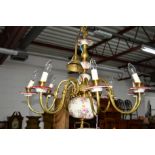 A MODERN BRASS AND FLORAL CERAMIC EIGHT BRANCH CHANDELIER