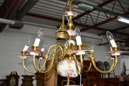 A MODERN BRASS AND FLORAL CERAMIC EIGHT BRANCH CHANDELIER