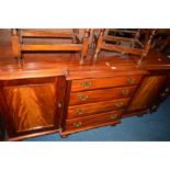 A VICTORIAN FLAME MAHOGANY BREAKFRONT SIDEBOARD with four long graduating drawers central to two