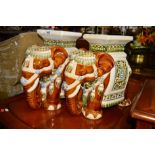 A PAIR OF GLAZED CERAMIC ELEPHANT STOOLS