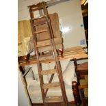 A TALL WOODEN STEP LADDER