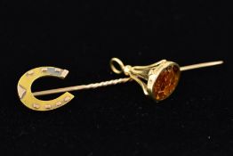 AN EDWARDIAN 15CT GOLD STICKPIN AND A GOLD FOB CHARM, the Edwardian stick pin with a horse shoe