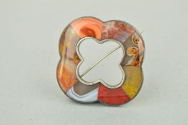 ALATE VICTORIAN SCOTTISH AGATE BROOCH of quatrefoil outline inlaid with various agate pieces to