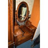 AN OAK BARLEY TWIST DRESSING CHEST with a single oval mirror, together with another similar dressing