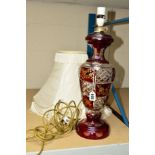 A LARGE RUBY FLASHED GLASS TABLE LAMP, with a cream shade, height 42cm (not including fitting)